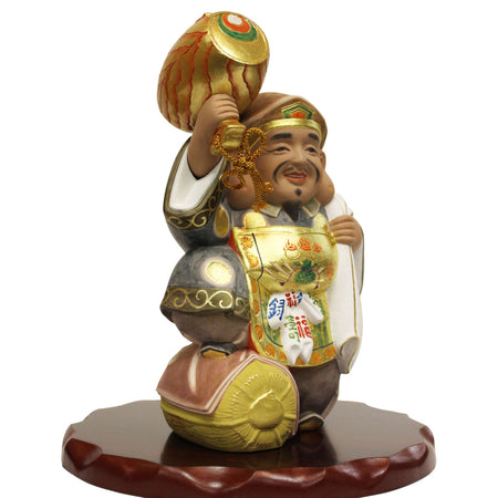 Daikokuten Hakata Doll by Susumu Ueki, 25cm tall figurine holding a mallet and standing on a wooden base