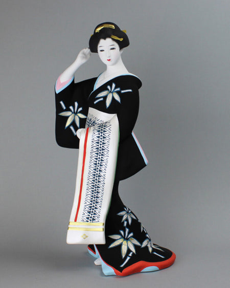 Hakata Presentation doll in black kimono with floral design standing gracefully, traditional Japanese Hakata Kenjo statue.
