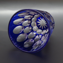 Free Glass Ni-Tama featuring blue crystal glass with two tiers of oval beads reflecting a diamond-like glittering pattern.