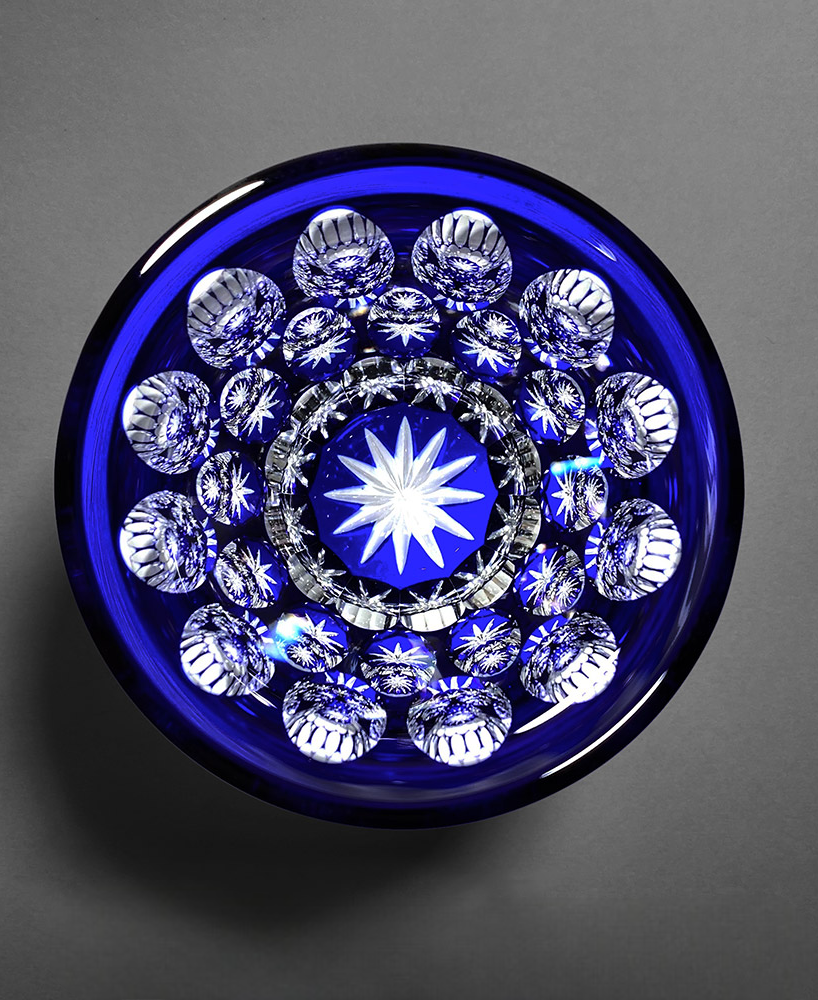 Free Glass Ni-Tama blue crystal glass with oval bead cut pattern creating sparkling diamond-like reflections.