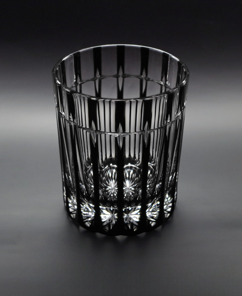 Cross Rock glass with stylish cross cuts reflecting a bright pattern, made from black crystal glass, 200ml capacity.