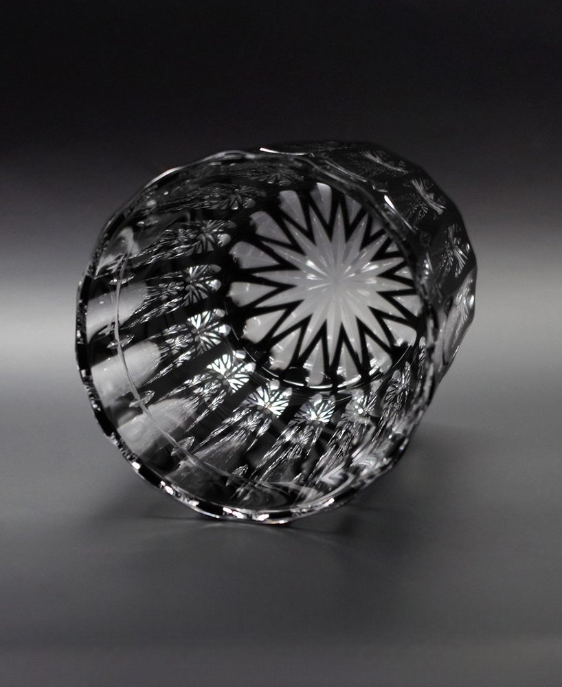 Cross Rock glass showing intricate cross cuts and star pattern at the bottom in black crystal glass design.